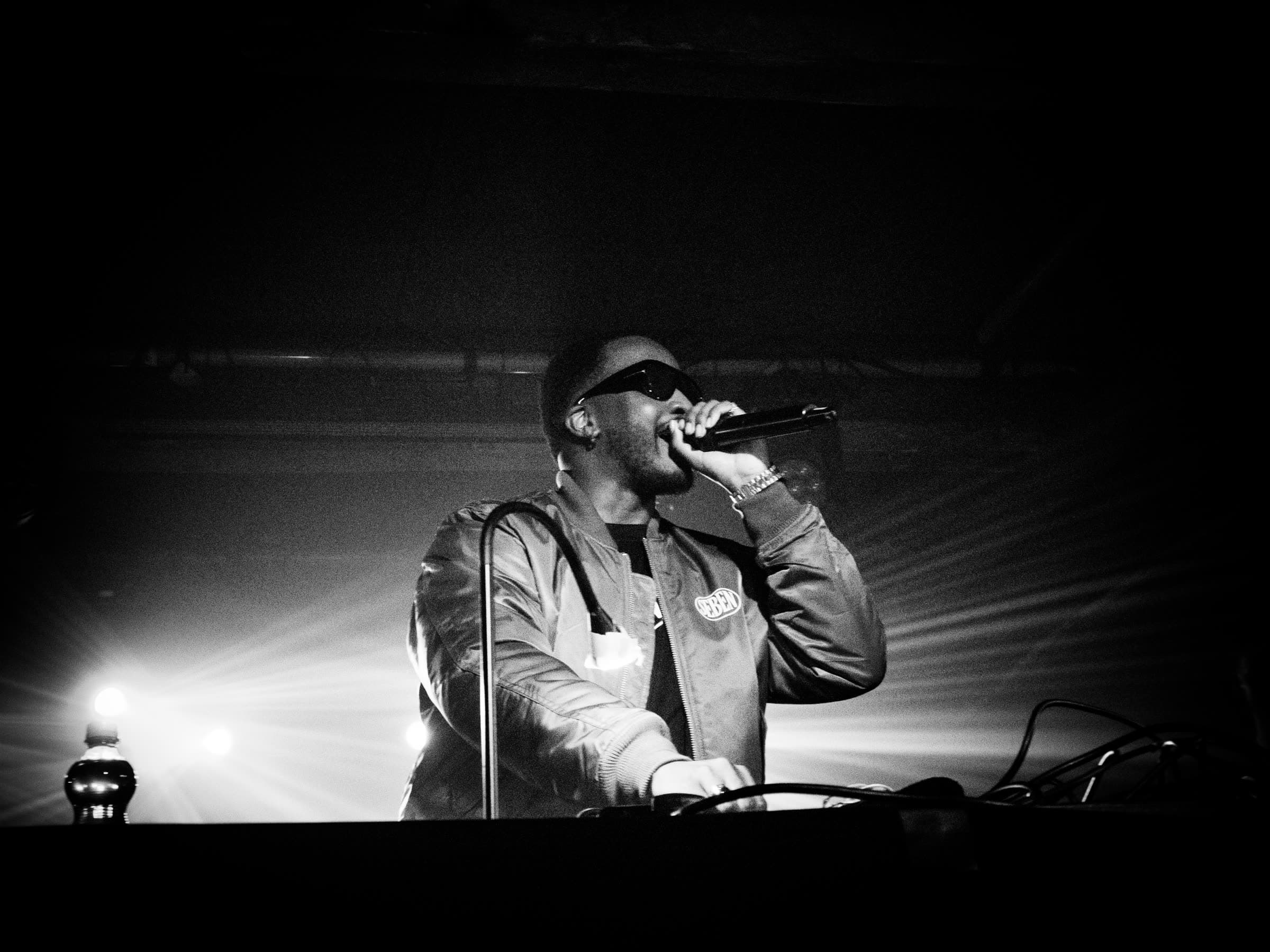 DJ SEBEN wearing the SEBEN logo tee